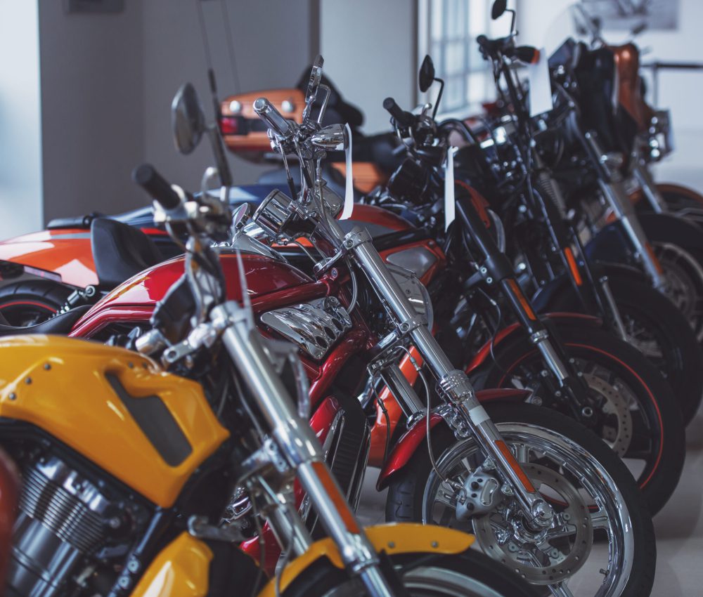 Row of modern colorful motorbikes, presenting in motorbike salon